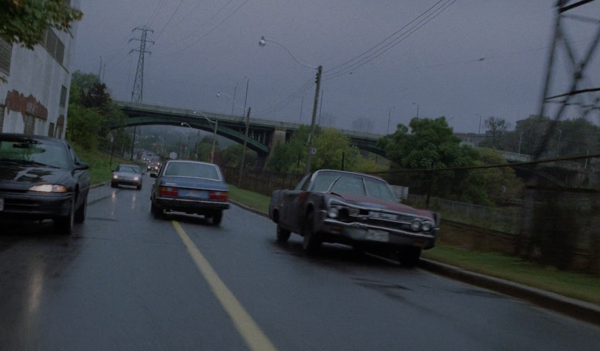 James, driving Vaughan's car, flies into the wrong lane.